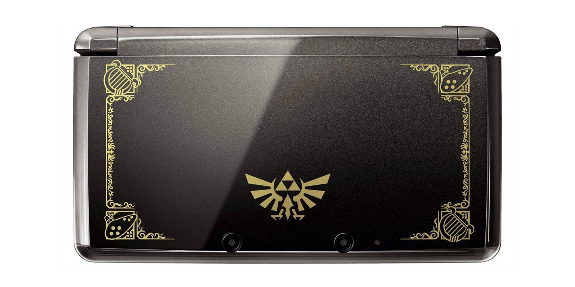 Black 3DS with gold frame and Zelda Hyrule crest.