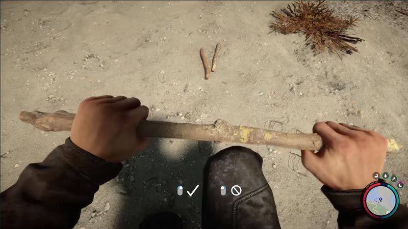 Player breaks a stick on the beach in Children of the Forest