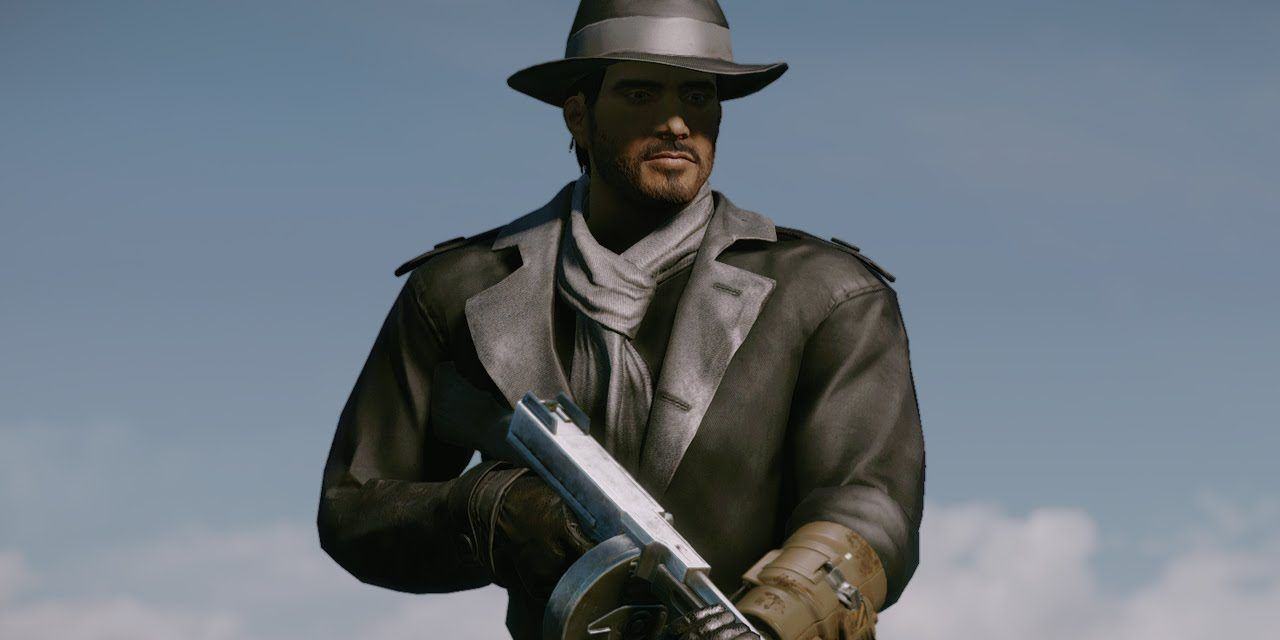 A player character in Fallout 4 wearing the Silver Shroud costume, black and silver trench coat and fedora, while holding a Tommy Gun.