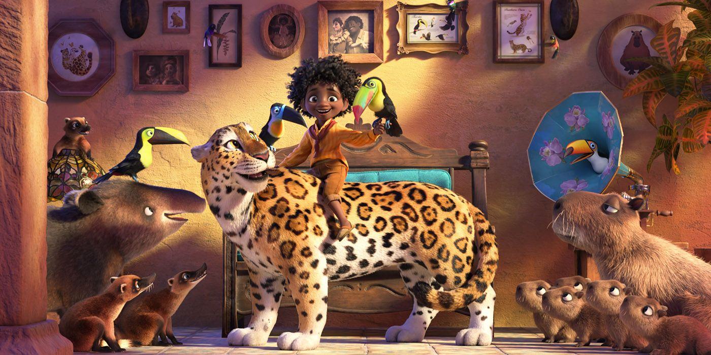 Antonio hugs a tiger and holds a bird in Disney's Encanto.