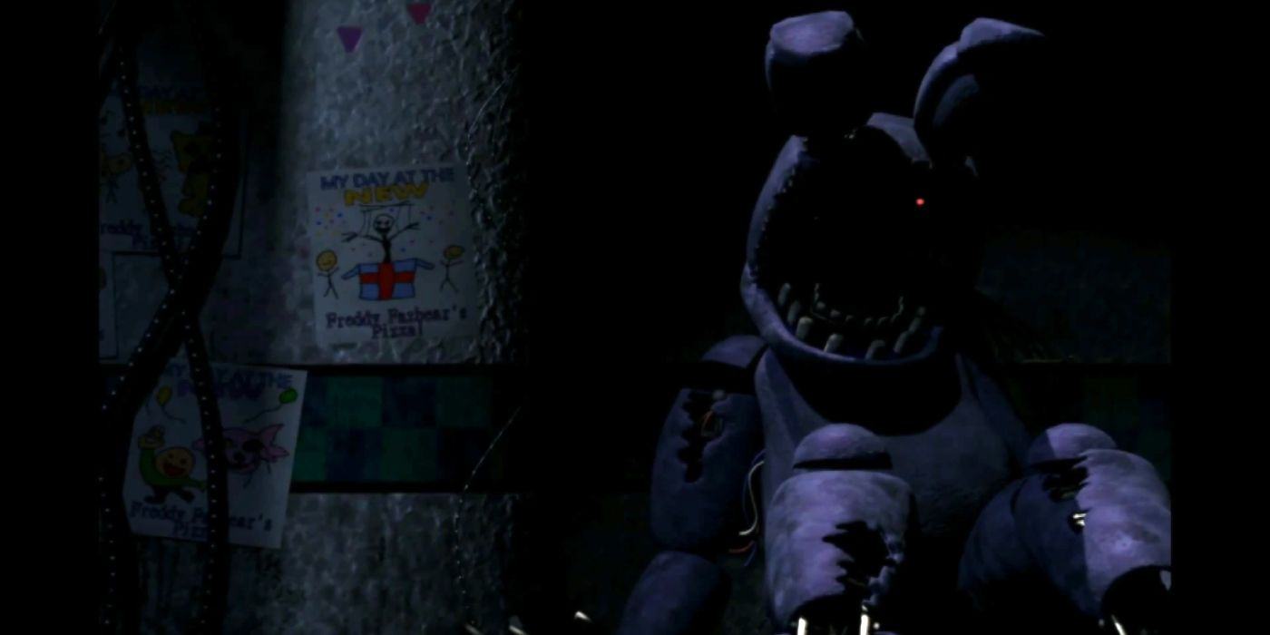 Withered Bonnie, from Five Nights at Freddy's 2, sat on the pizzeria floor with one eye burning red.
