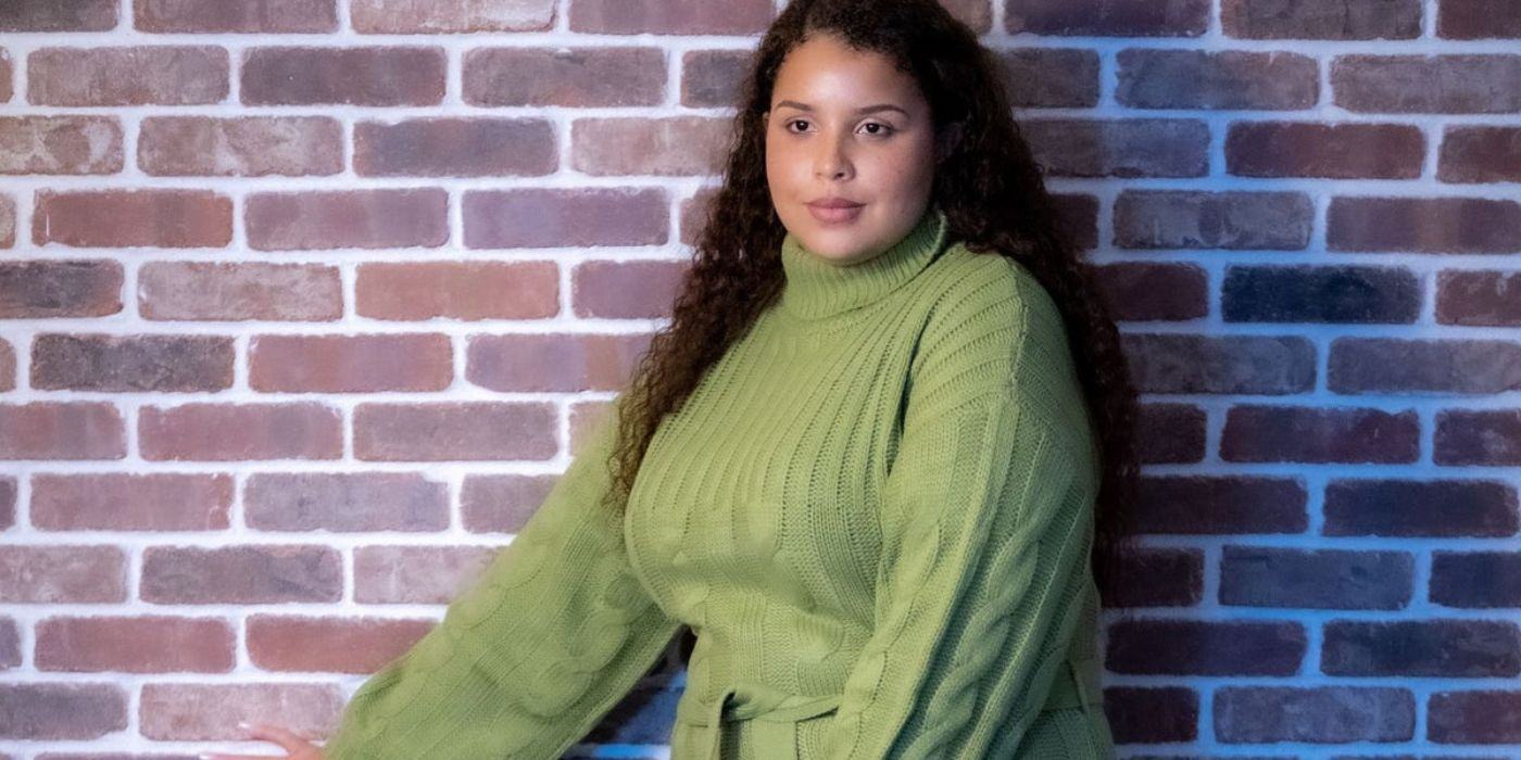 The Family Chantel star Winter Everett posed against the brick wall in a green wool dress