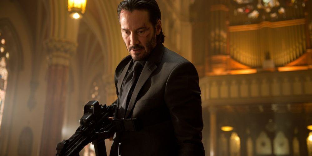 John Wick, armed with an assault rifle