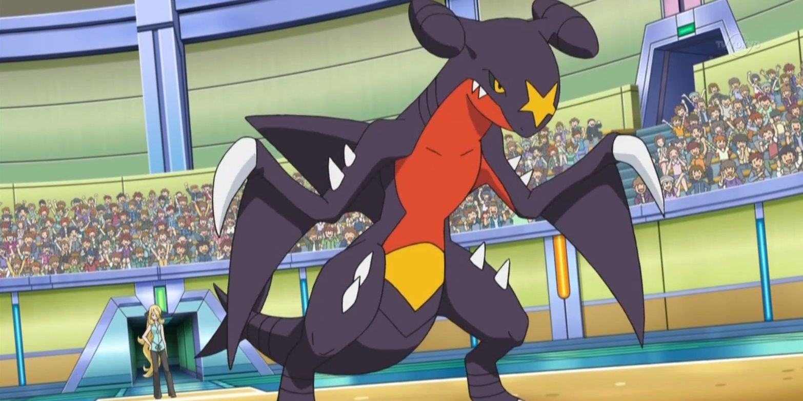 Cynthia's Garchomp stands in the arena of the Pokémon anime