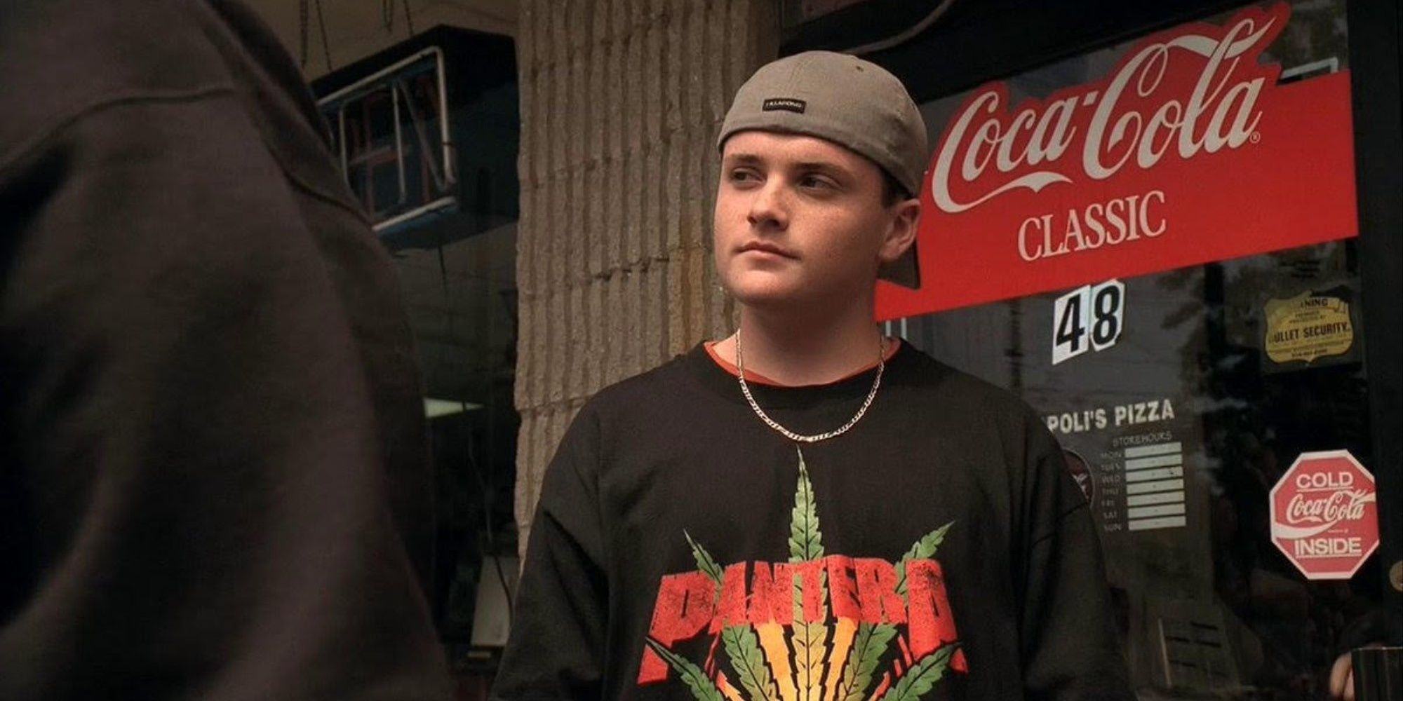 AJ Soprano meets friends to plan a night out at The Soprano in front of a Coca-Cola machine.