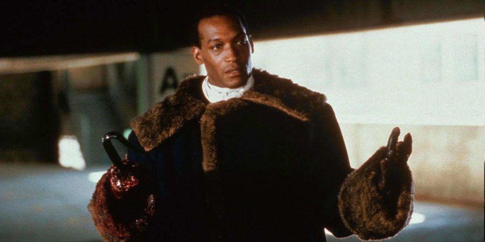 The Candyman (Tony Todd) open armed in the parking garage