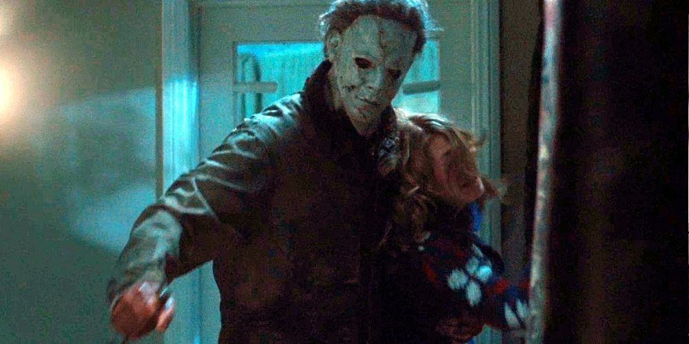 Michael Myers (Tyler Mane) dragging a victim down a hallway in Rob Zombie's Halloween (2007)