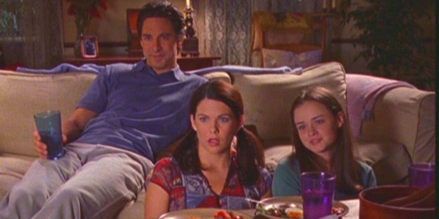 Max and Lorelai watch TV with Rory in Gilmore Girls