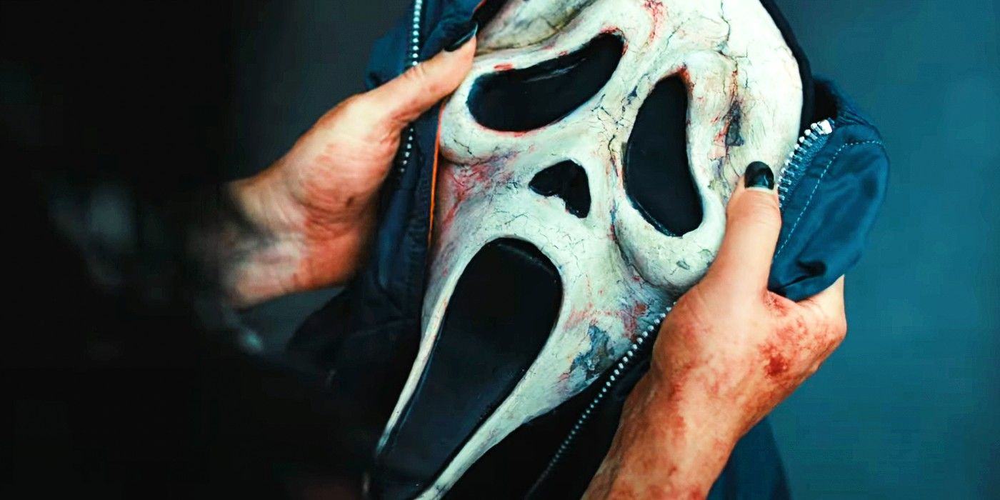 Sam holds a cracked, bloody Ghostface mask in Scream 6 
