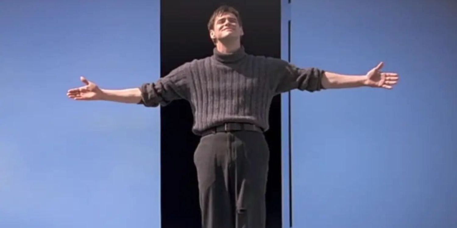 Image of Truman Burbank standing with arms outstretched in The Truman Show