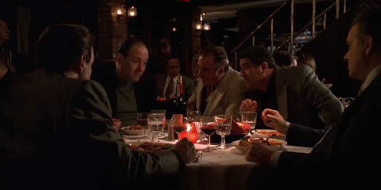 Paulie Walnuts tells jokes over dinner at The Sopranos