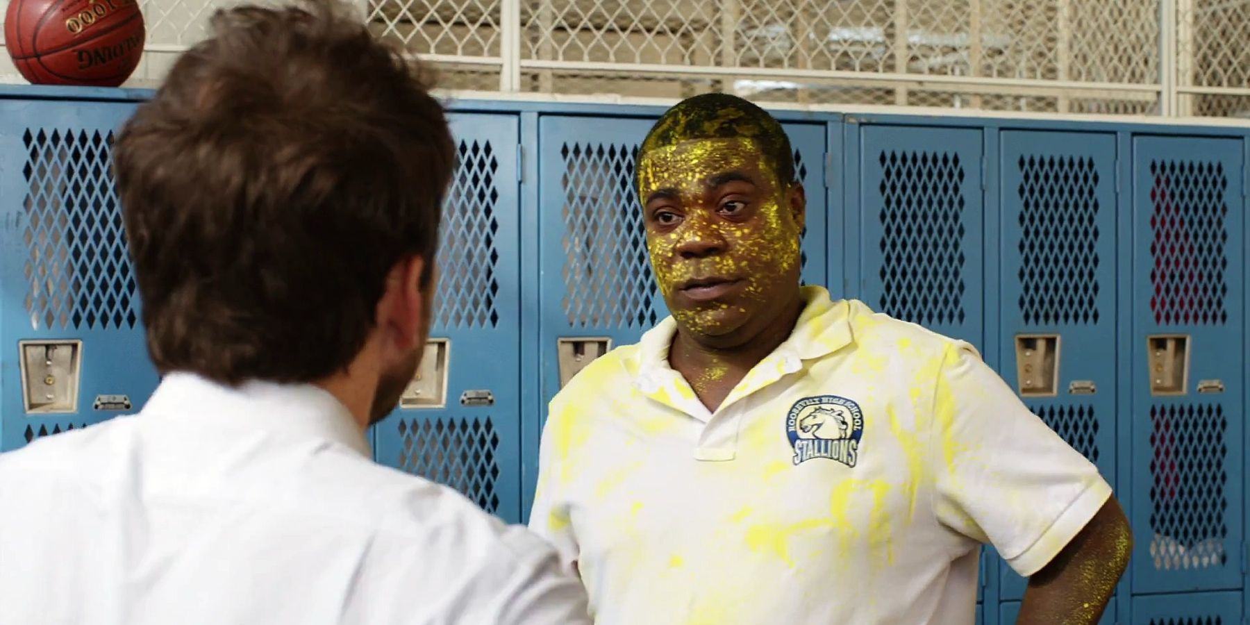 Painted in yellow, Charlie Day and Tracy Morgan chat in the duel dressing room