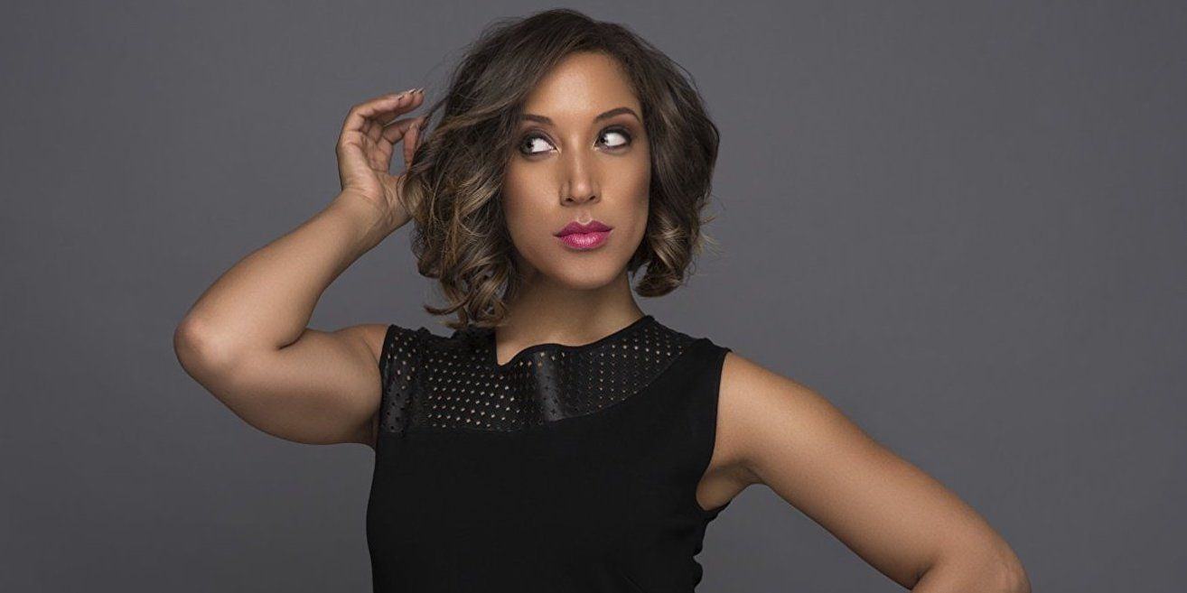 Robin Thede poses against a gray background in the promotional image for The Rundown