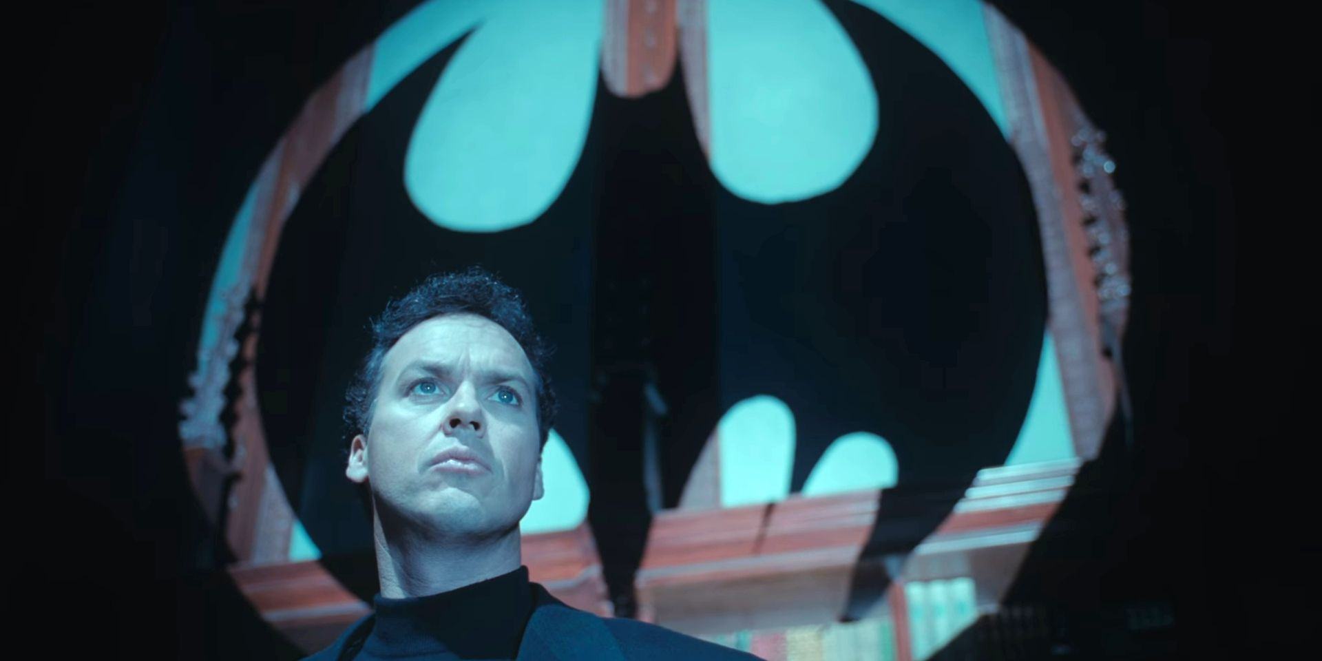 Bruce Wayne in front of the Batsignal in Batman Returns