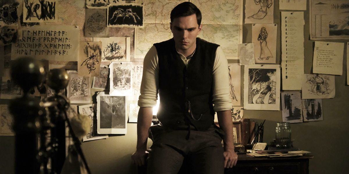 tolkien leans on his desk in the movie