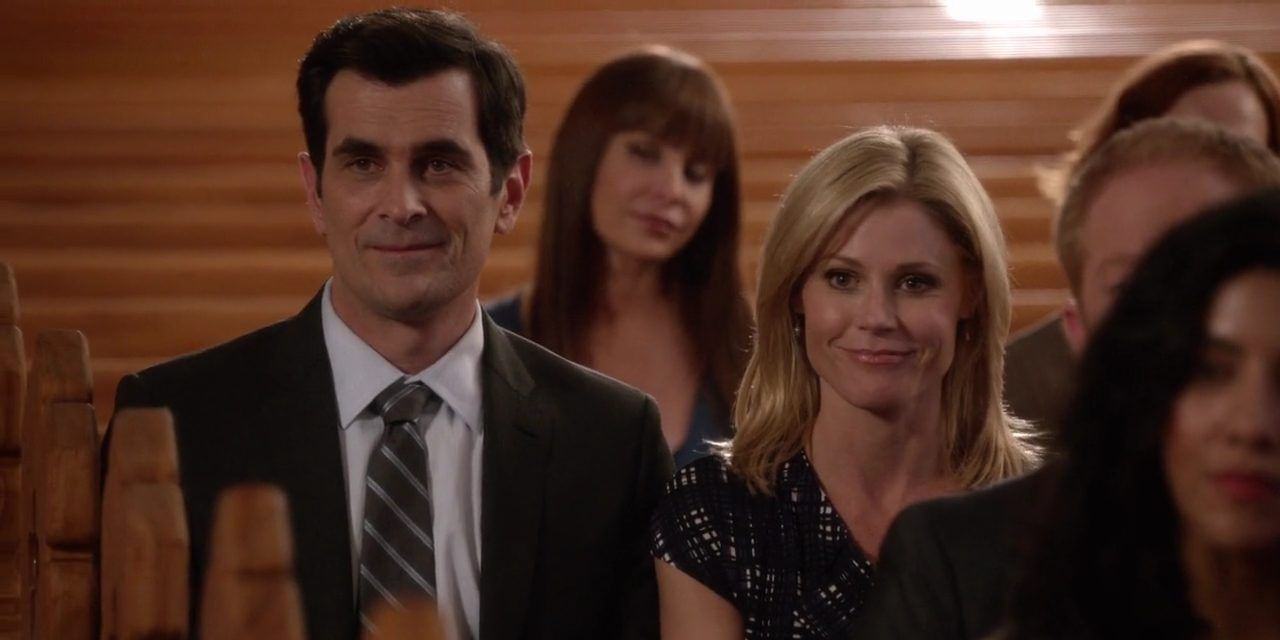 Claire and Phil at Joe's baptism on Modern Family