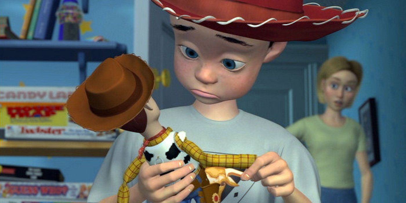 Andy looks sad with Woody in Toy Story while his mother comforts him in the background