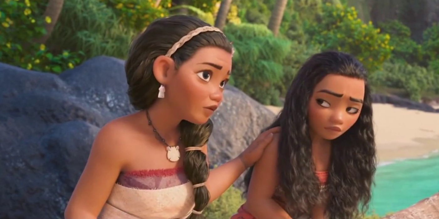 Sina comforts Moana on the beach at Disney's Moana