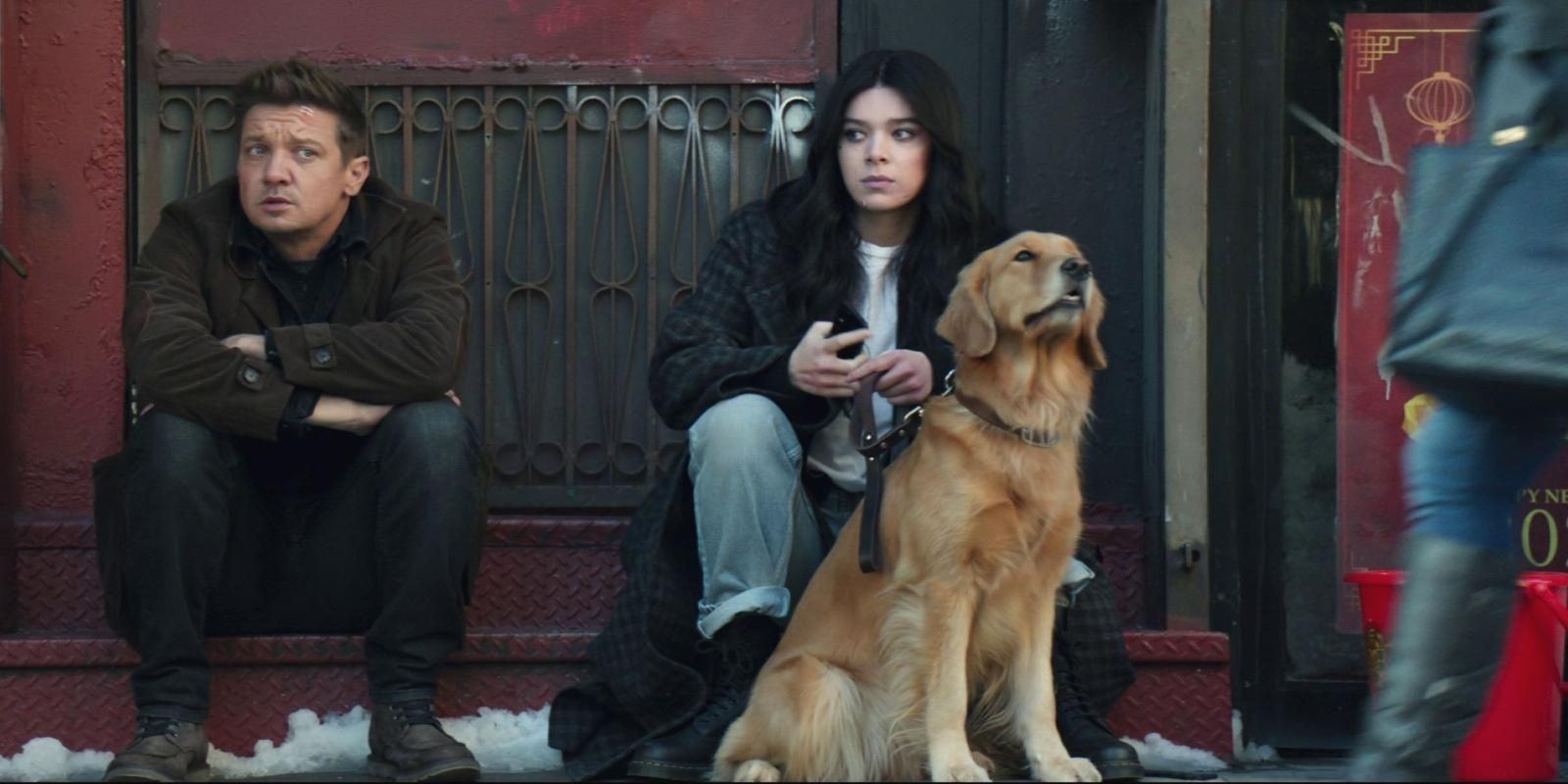 Kate Bishop sits with Clint Barton and her pizza dog Lucky at Hawkeye