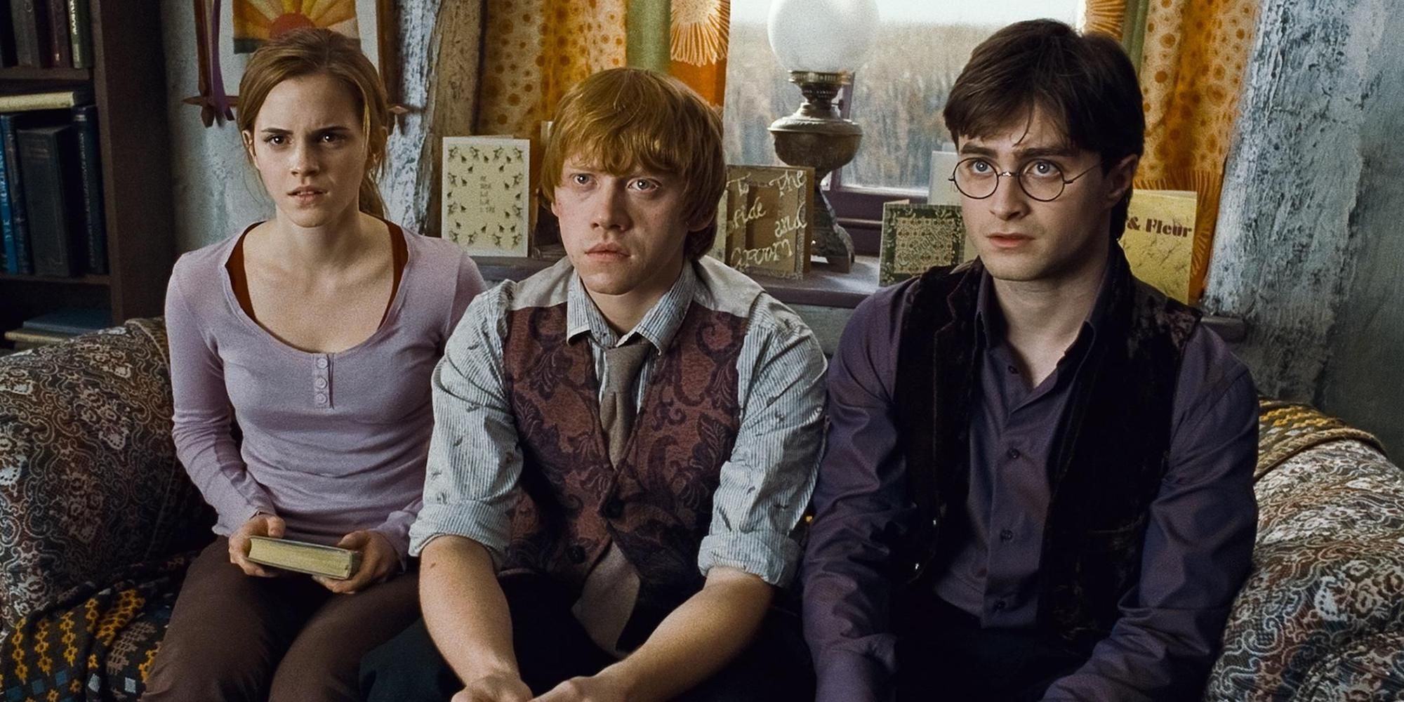 In Harry Potter and the Deathly Hallows Part 1, Harry, Ron, and Hermione sit together looking confused.