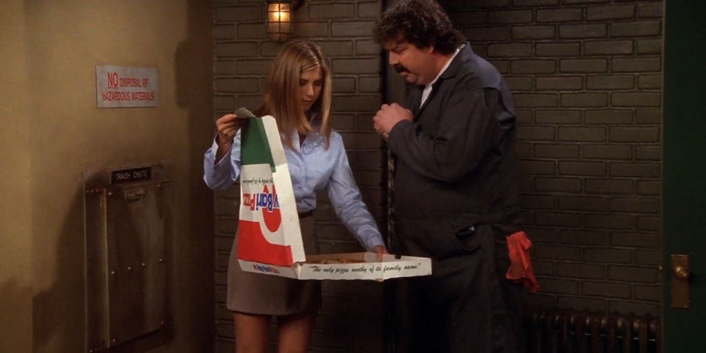 Rachel serves old pizza slices to Mr. Trigg in the junk room 