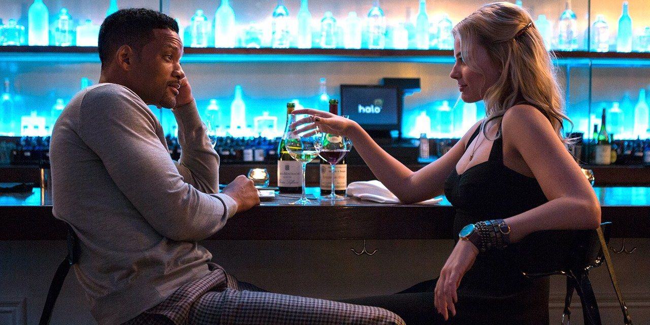 Will Smith and Margot Robbie sitting at the bar looking at each other