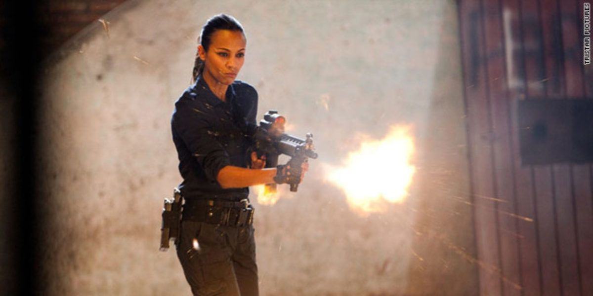 Zoe Saldana fires an assault rifle in Colombia