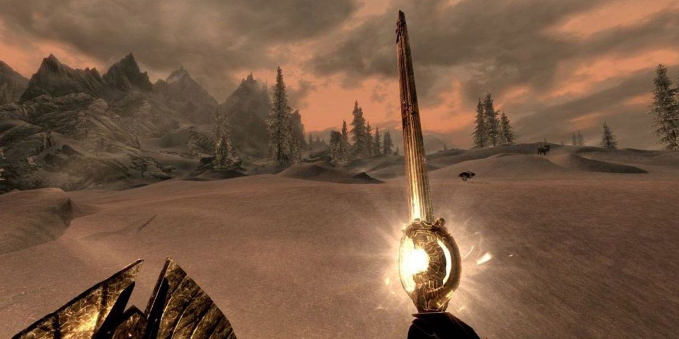 A player holding Dawnbreaker in Skyrim during a snowy sunrise.