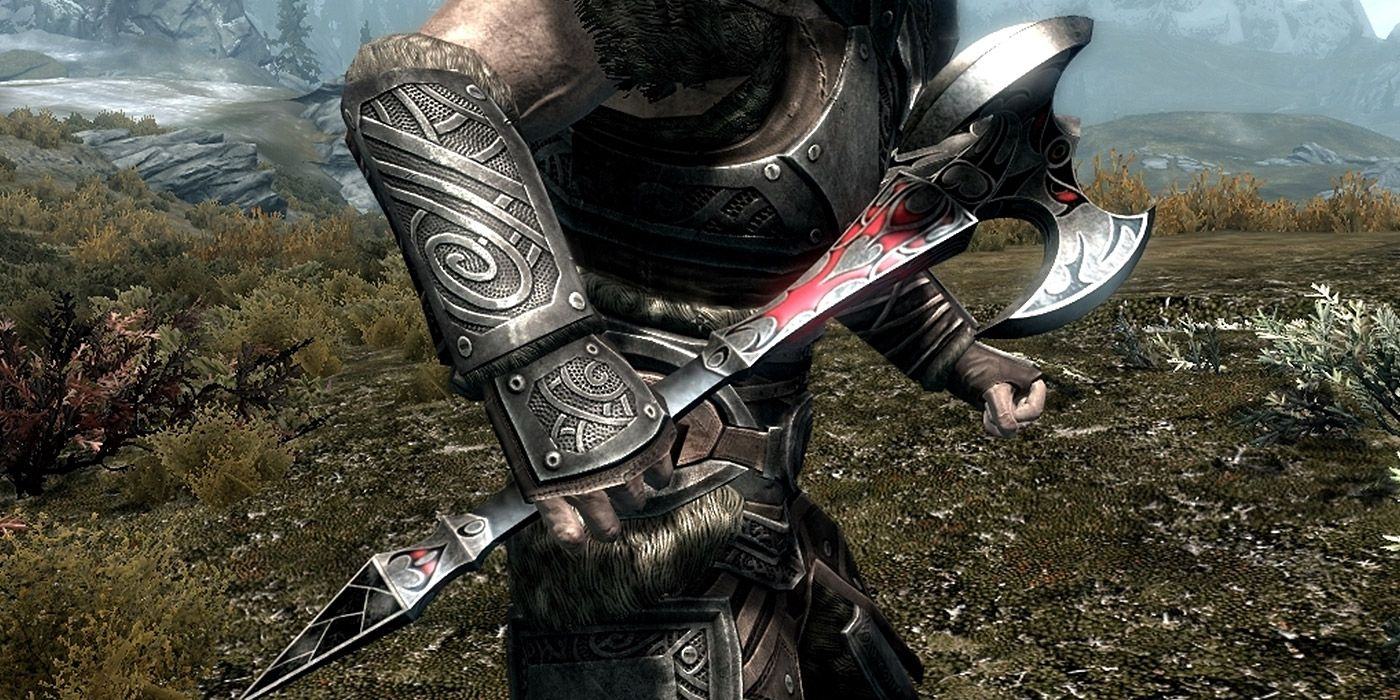 A close-up of a player holding the Dragonbone Mace in Skyrim, ready for battle.