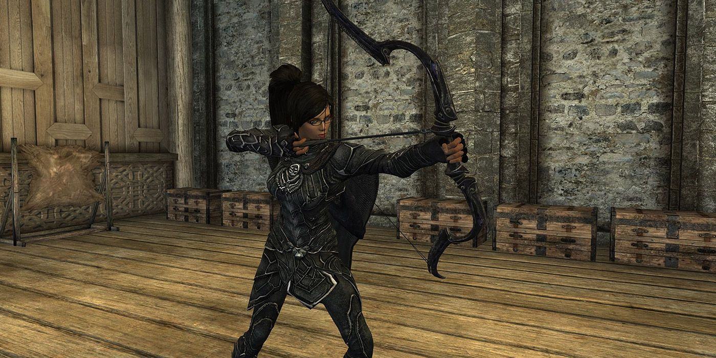 A female player holding the Dwarven Black Bow in Skyrim