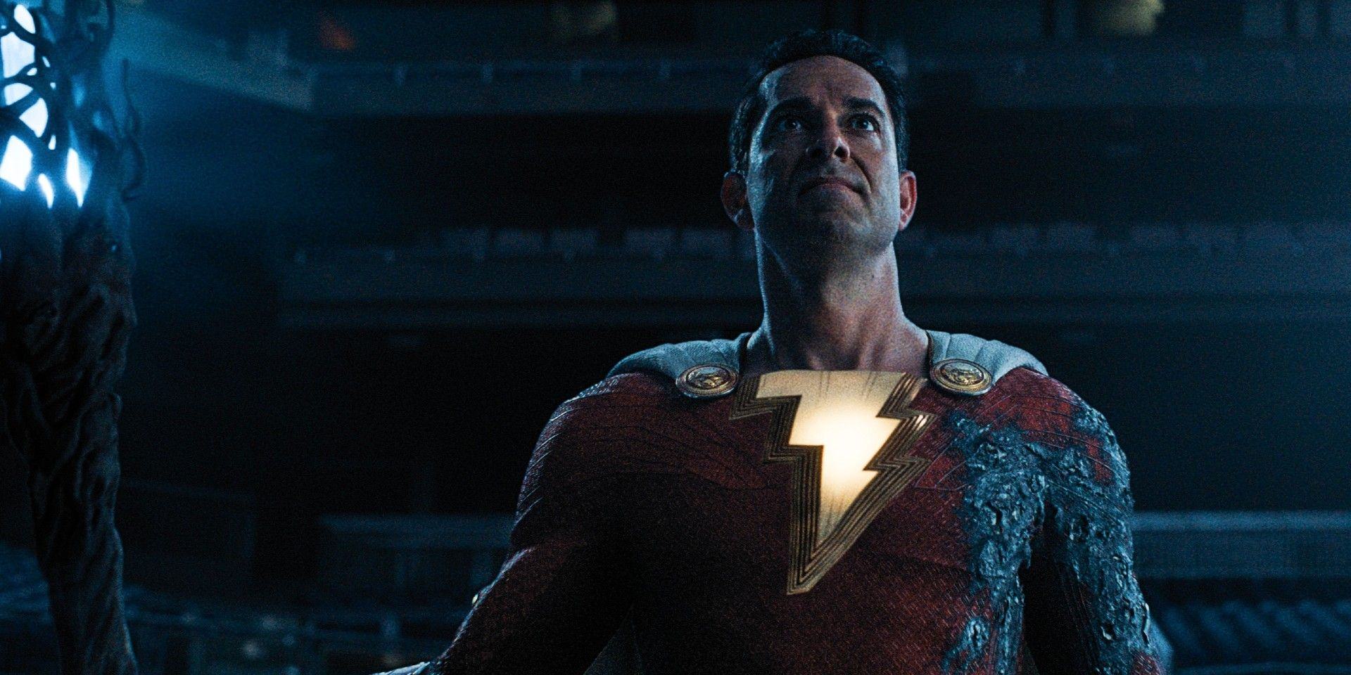 Zachary Levi wearing a Shazam suit burned in Shazam!  wrath of the gods